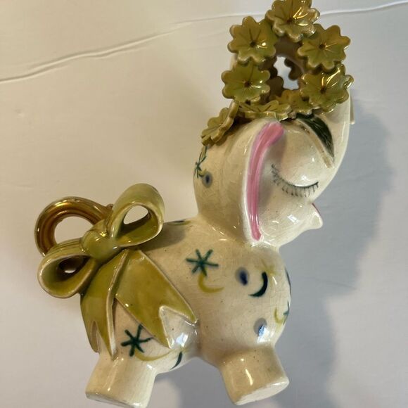 A decorated Elephant? Ceramic. Pink ears. Nose in air. Flowers on trunk. Eyelash - Picture 10 of 14